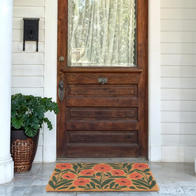 Fttoyoly welcome mat at the front door features Boho style and a non-slip backing.