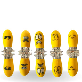Fumiko corn holders with playful faces for easy, fun corn on the cob serving.