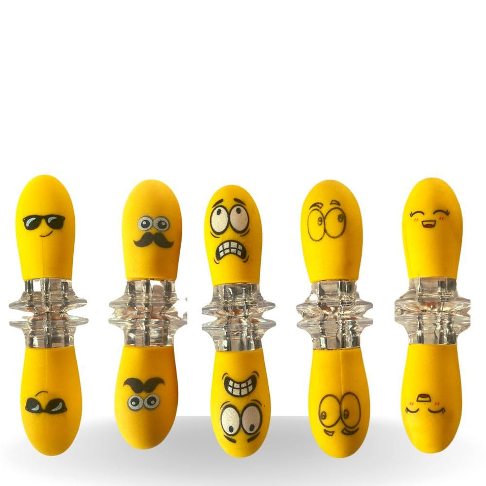 Fumiko corn holders with playful faces for easy, fun corn on the cob serving.
