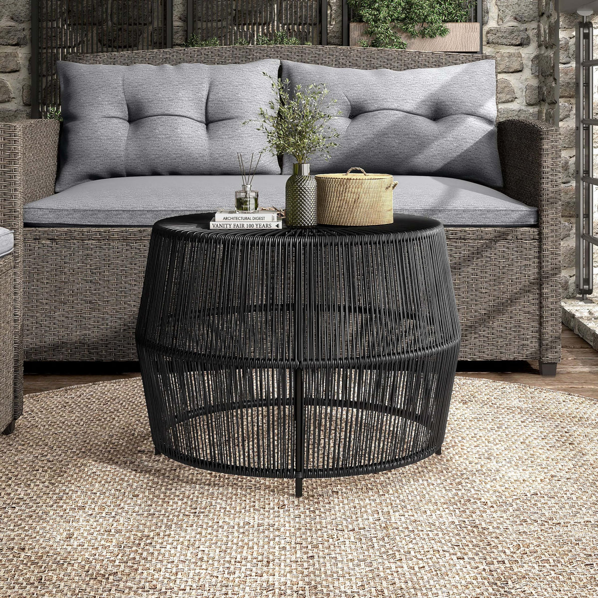 Furniture of America Ysar sturdy metal frame supports a round wicker table.