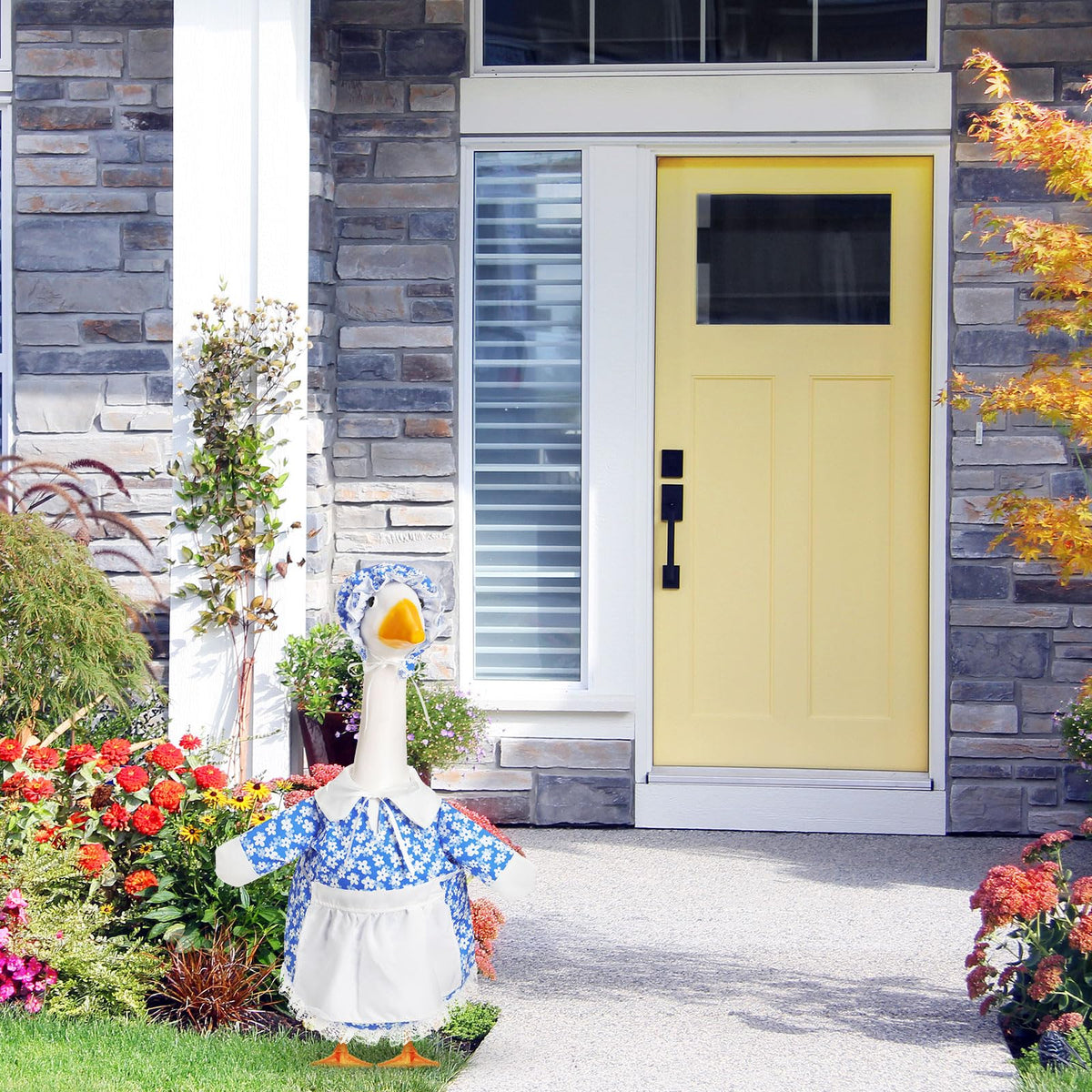Lace details add charm to porch goose display.