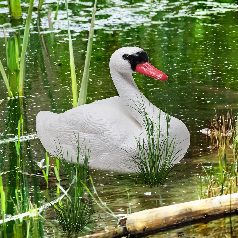 Galashield Swan decoy on water, lifelike charm boosts pond appeal.