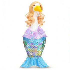 GANSHAYA Mermaid dress on a goose statue adds playful seaside charm.