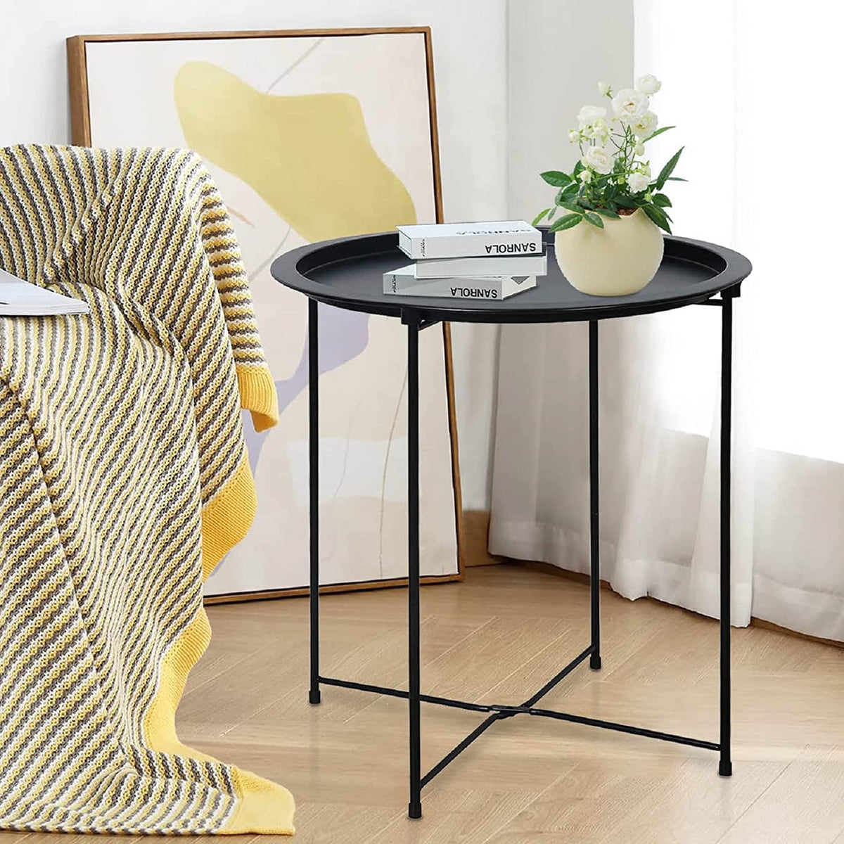 Garden 4 You end table round cyan provides a bright accent beside the sofa