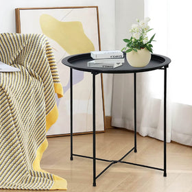 Garden 4 You end table round cyan provides a bright accent beside the sofa