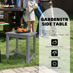 GardenSTAR table grey with UV-resistant finish supports outdoor coffee and books.