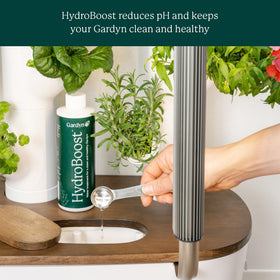 Gardyn HydroBoost pour action; quick mix into reservoir for weekly care.