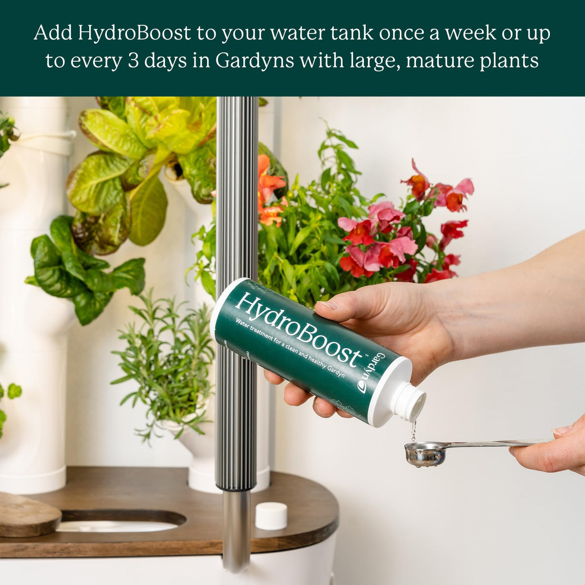 Gardyn HydroBoost tank-dilution scene; demonstrates a simple weekly maintenance step.