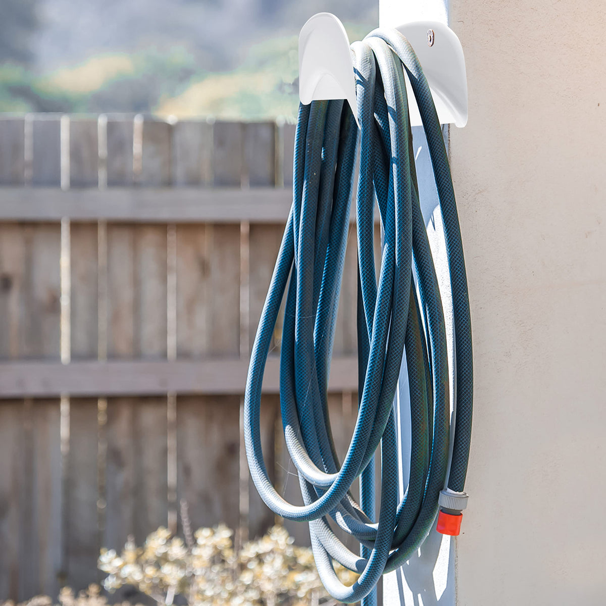 Gardzen hose rack organized outdoors for easy access and neat storage