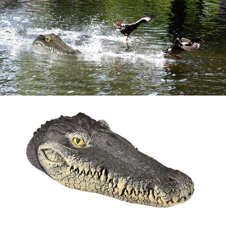 GARTENGERATE alligator head decoy floats, deterring birds in ponds.