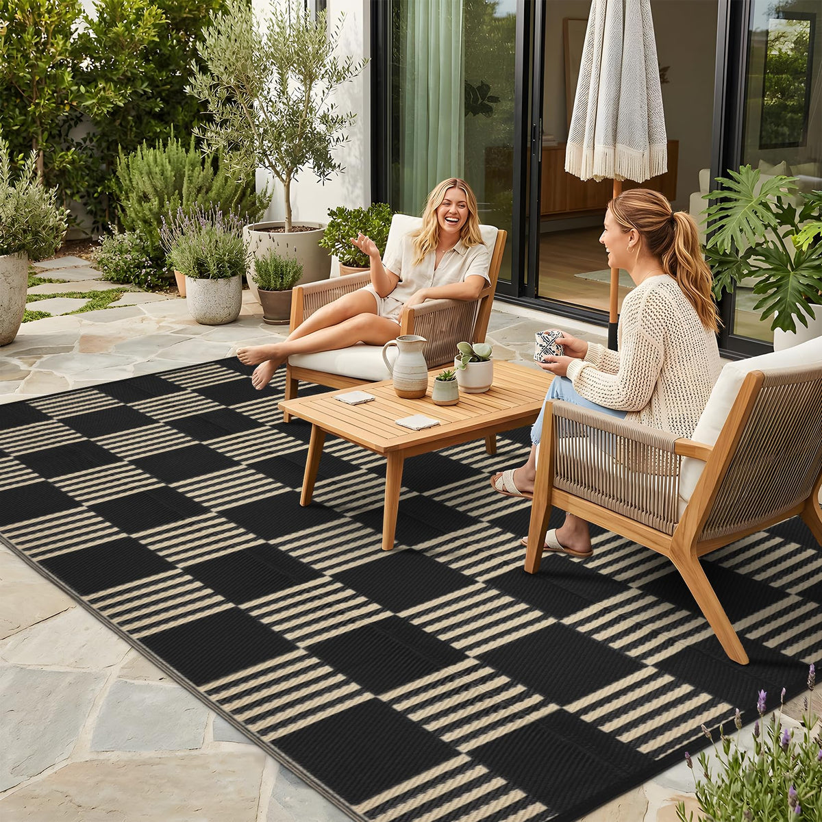Garvee waterproof outdoor rug 5x8 on deck, ideal for rain-free entertaining.