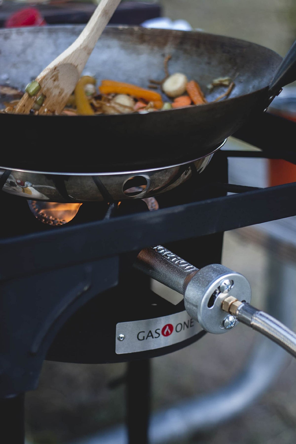 Gas One B-3000H-15 outdoor cooking action with a simmering pot.