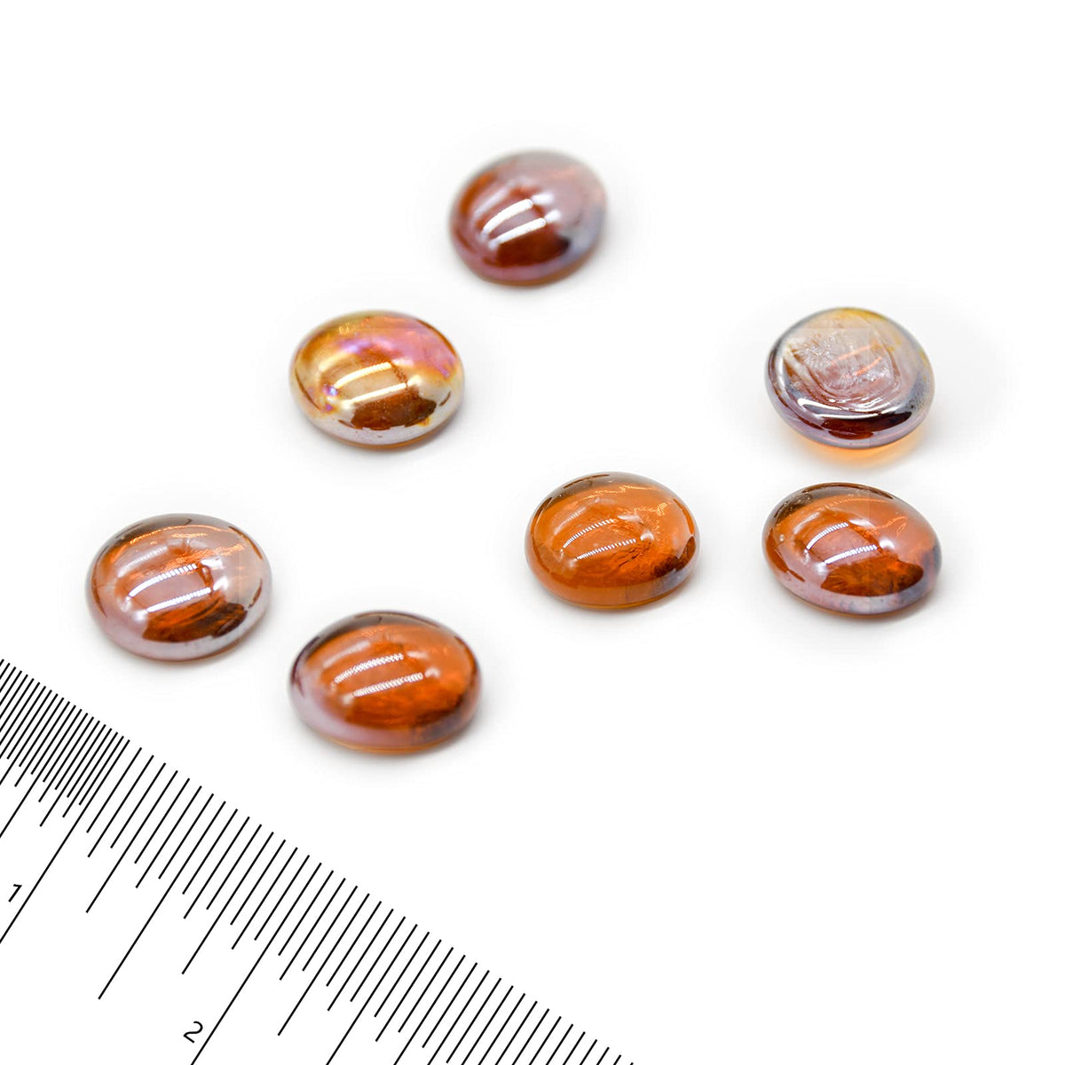 Close-up of GasSaf Amber Luster glass drops showing jewel-like color