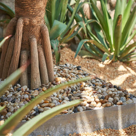 GASPRO outdoor landscaping rocks add color and texture to garden beds.