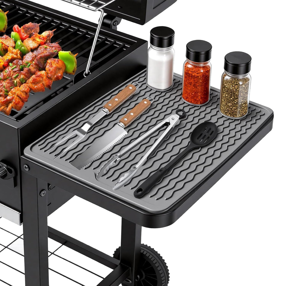 Geban silicone grill tools mat on side shelf protects counters from heat and spills.