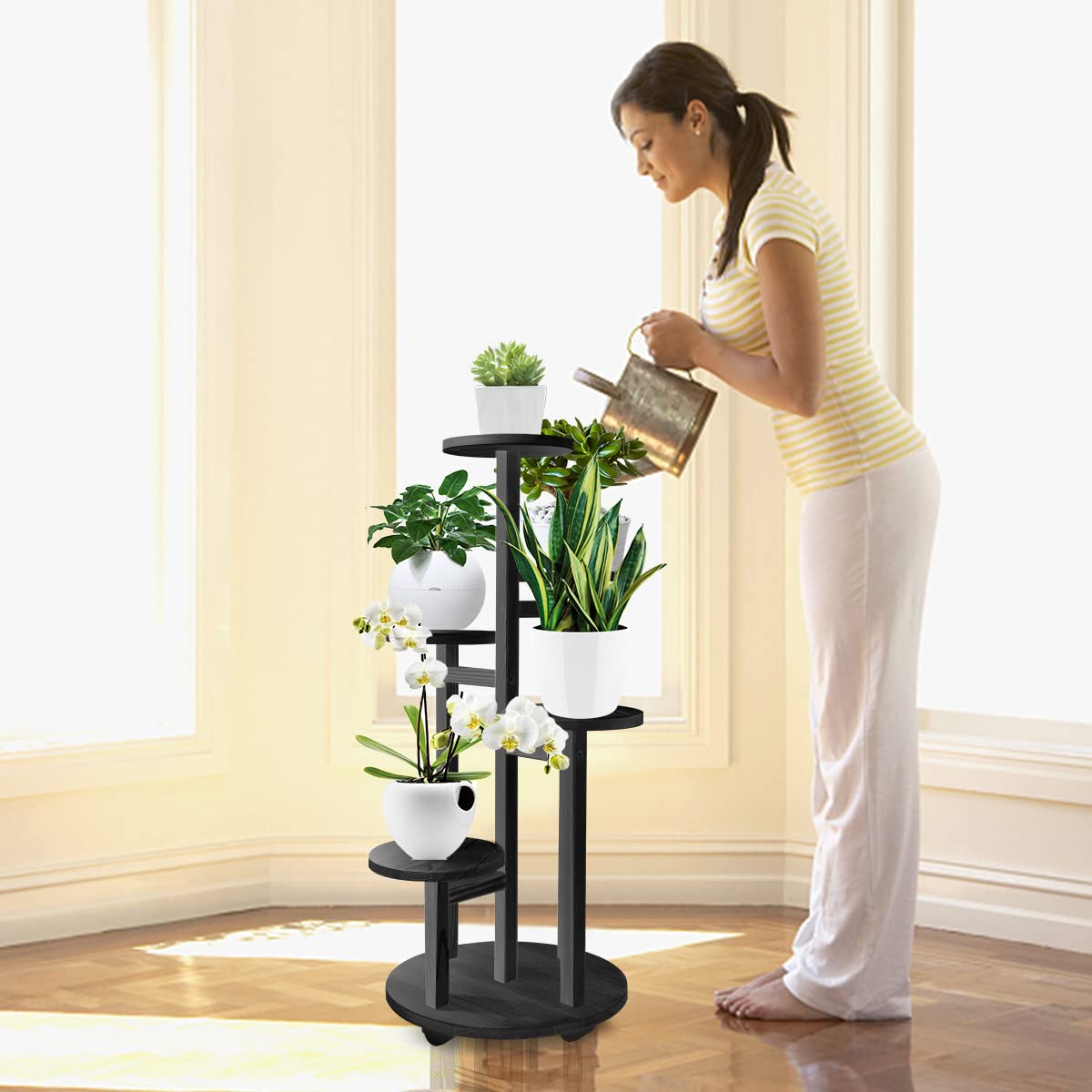 GEEBOBO black 5-tier stand placed in a living room corner