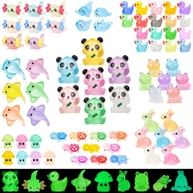 Generic luminous resin ducks for garden decor and nighttime glow.