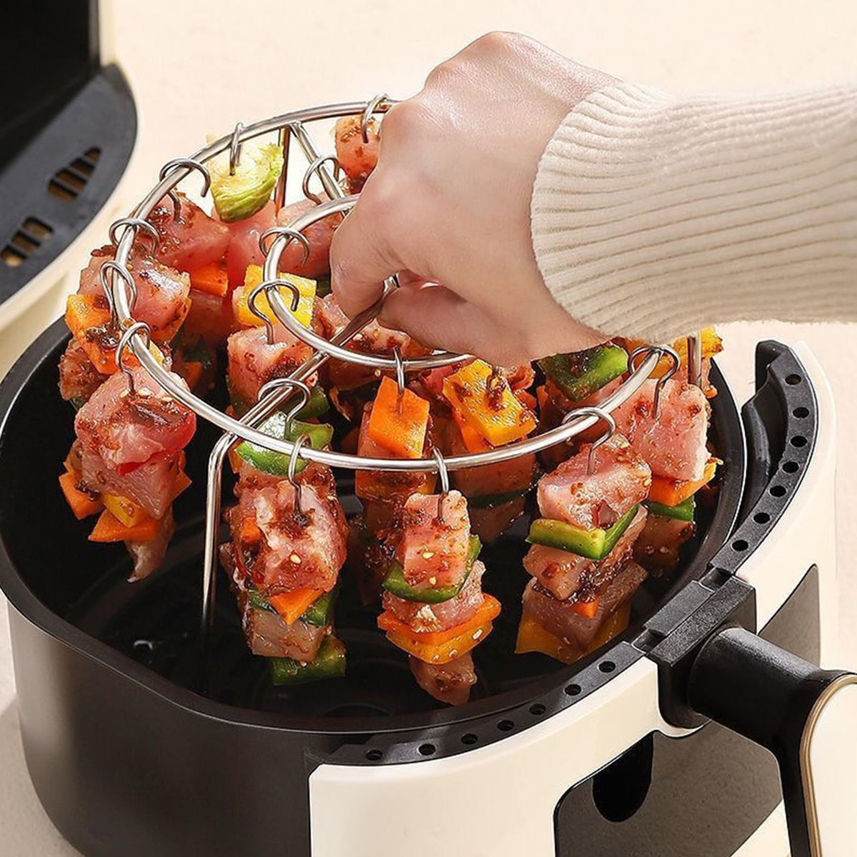 Generic barbecue skewers set for meat grilling with a circular rack.