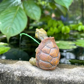 Compact turtle figurine fits tight garden corners.