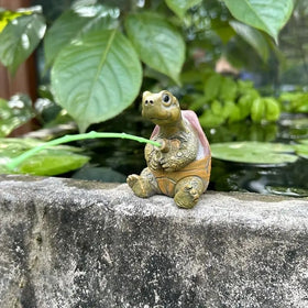 Durable resin turtle figure withstands outdoor elements.