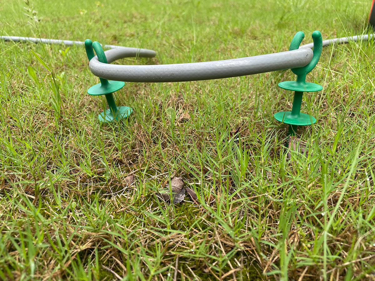 Generic garden hose guide holder material detail, PA66 durable plastic for longevity.