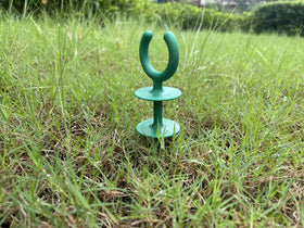 Generic garden hose guide holder green stable base, prevents tipping.