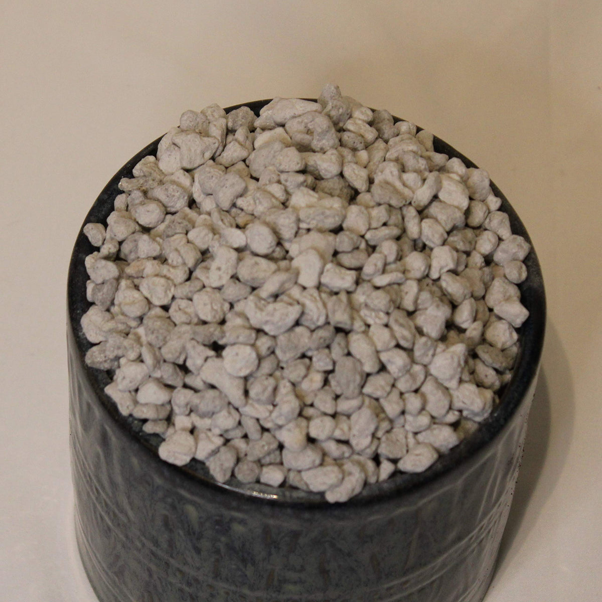 Generic Horticultural Pumice top dressing supports soil stability for plants.