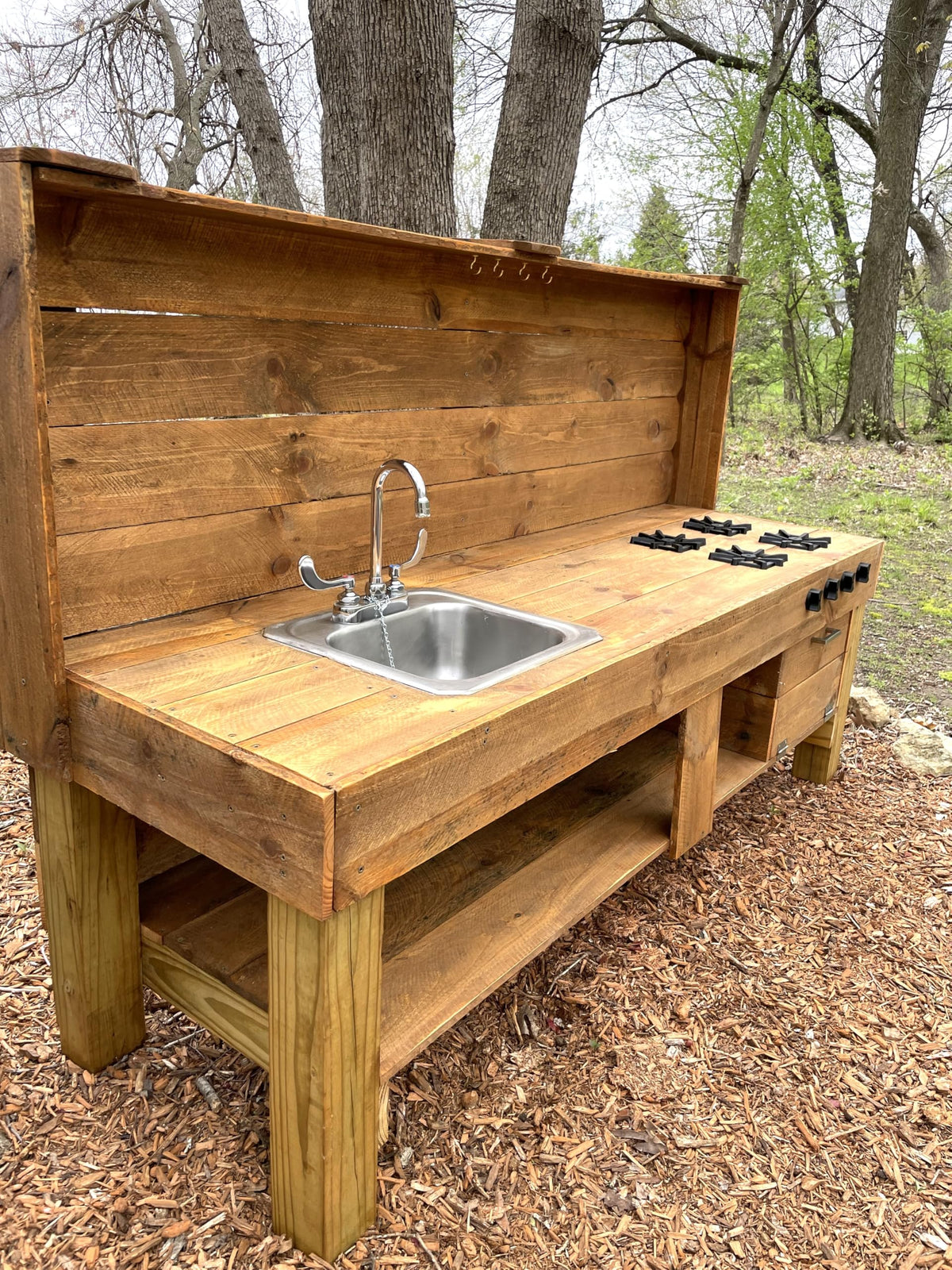 Generic Mud Kitchen Grill Burners assembled for a realistic pretend top.