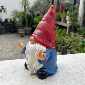 Generic naughty gnome hand-painted poly resin reveals detailed accents.