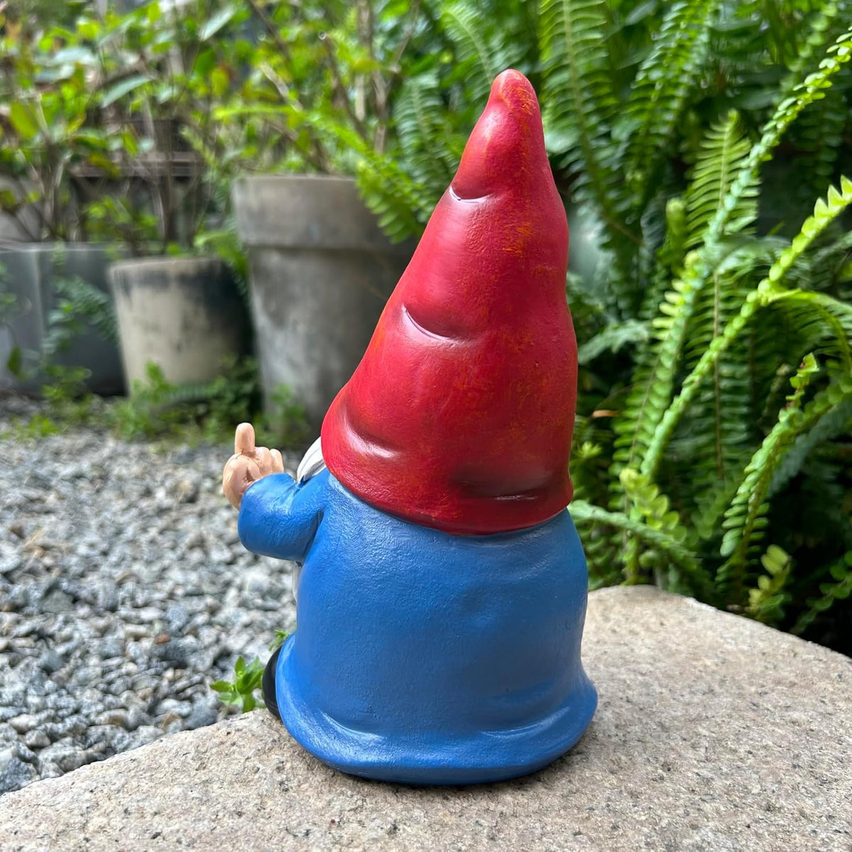 Generic office desk gnome decor complements workspace with humor.