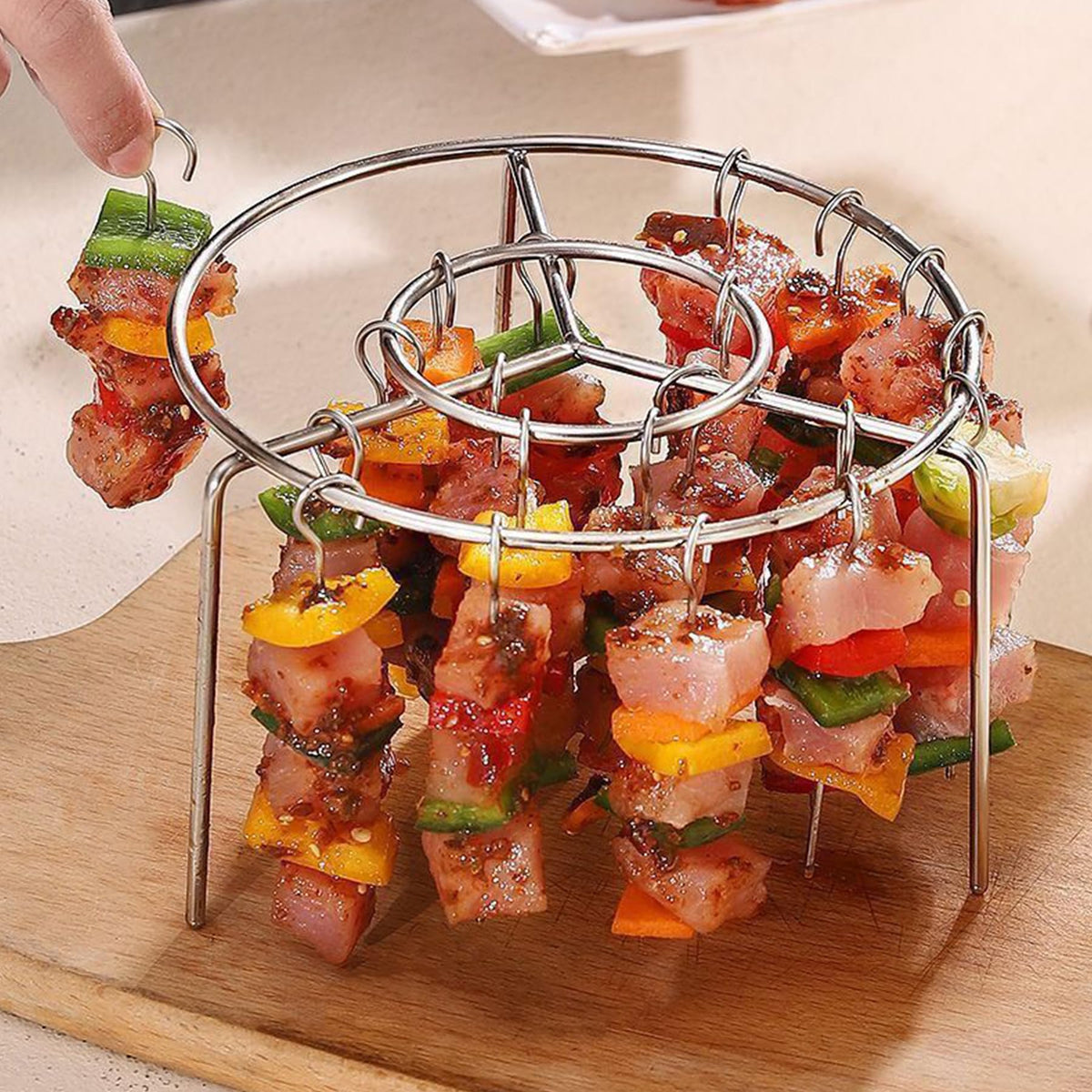 Generic vertical hanging design promotes even heat distribution across skewers.