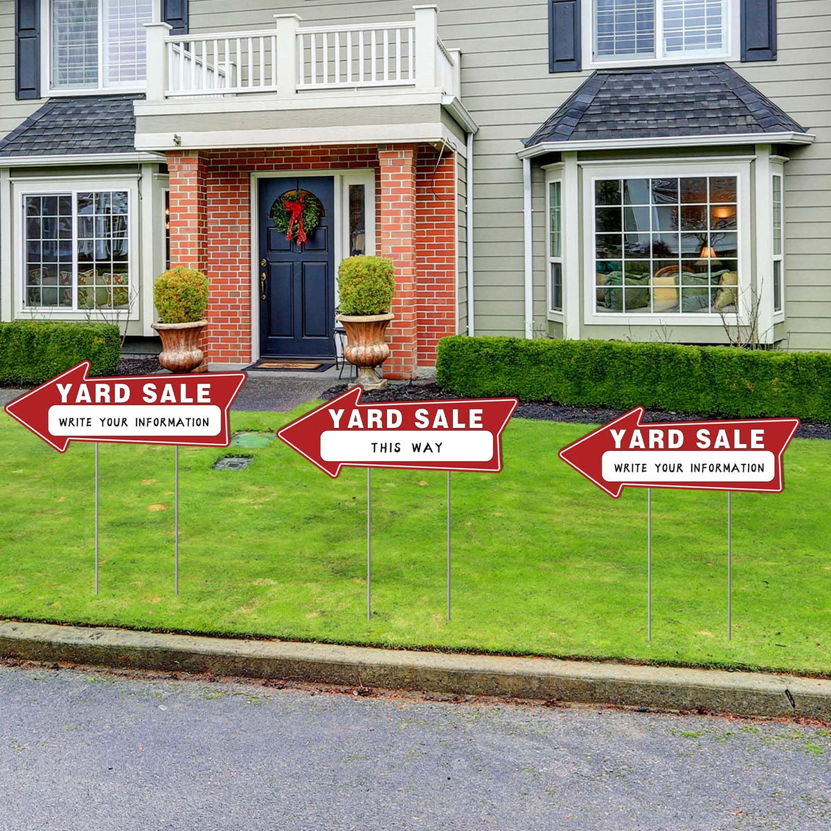 Generic yard sale arrow stickers add directional cues for buyers.