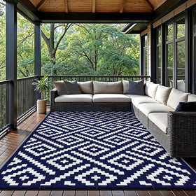 GENIMO rug showing reversible geometric surfaces in navy and white.