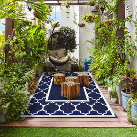 GENIMO 6x9 rug on deck pairs with outdoor furniture.