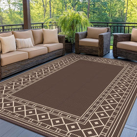 GENIMO outdoor rug with diamond frame design brightens porch decor on any patio.