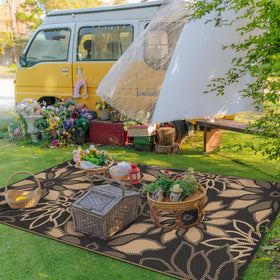 GENIMO lightweight rug folds for easy storage in RV camps.