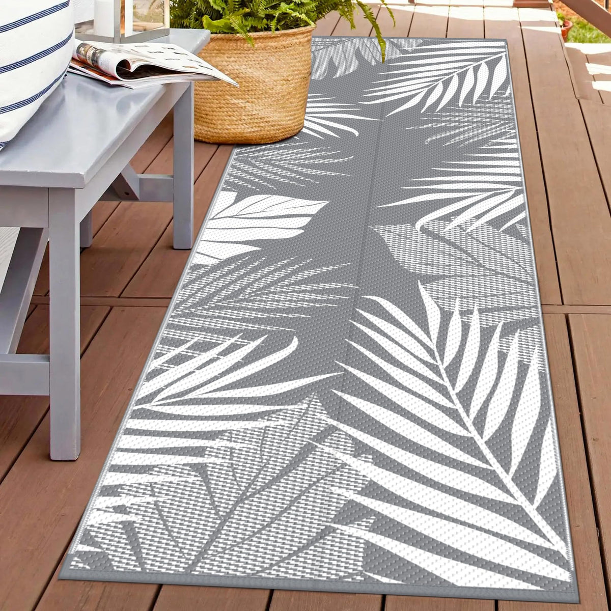 GENIMO outdoor rug palm leaf design, double-sided for versatile outdoor decor.