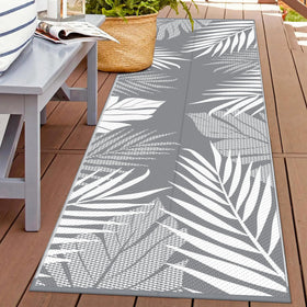 GENIMO outdoor rug palm leaf design, double-sided for versatile outdoor decor.