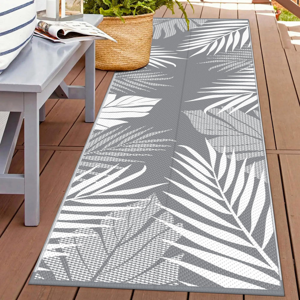 GENIMO outdoor rug palm leaf design, double-sided for versatile outdoor decor.