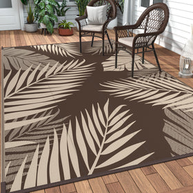 GENIMO outdoor rug palm leaf pattern enhances patio ambiance and comfort.