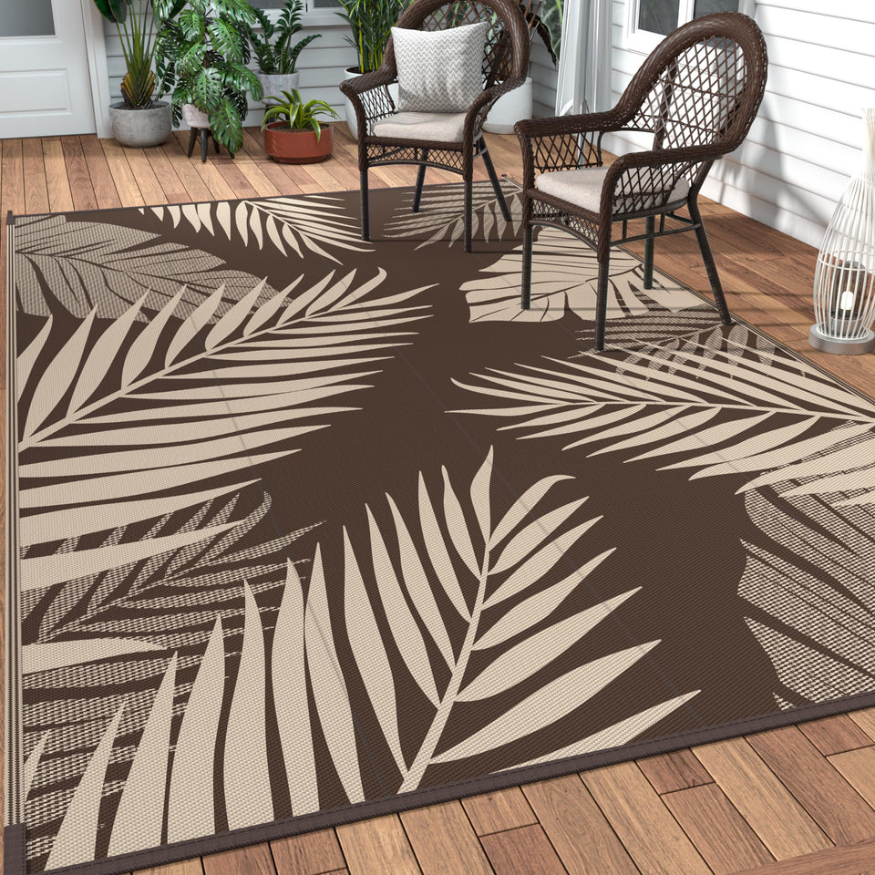 GENIMO outdoor rug palm leaf pattern enhances patio ambiance and comfort.