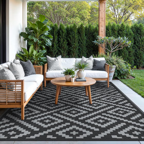 GENIMO outdoor rug rolled with carrying bag for easy transport.