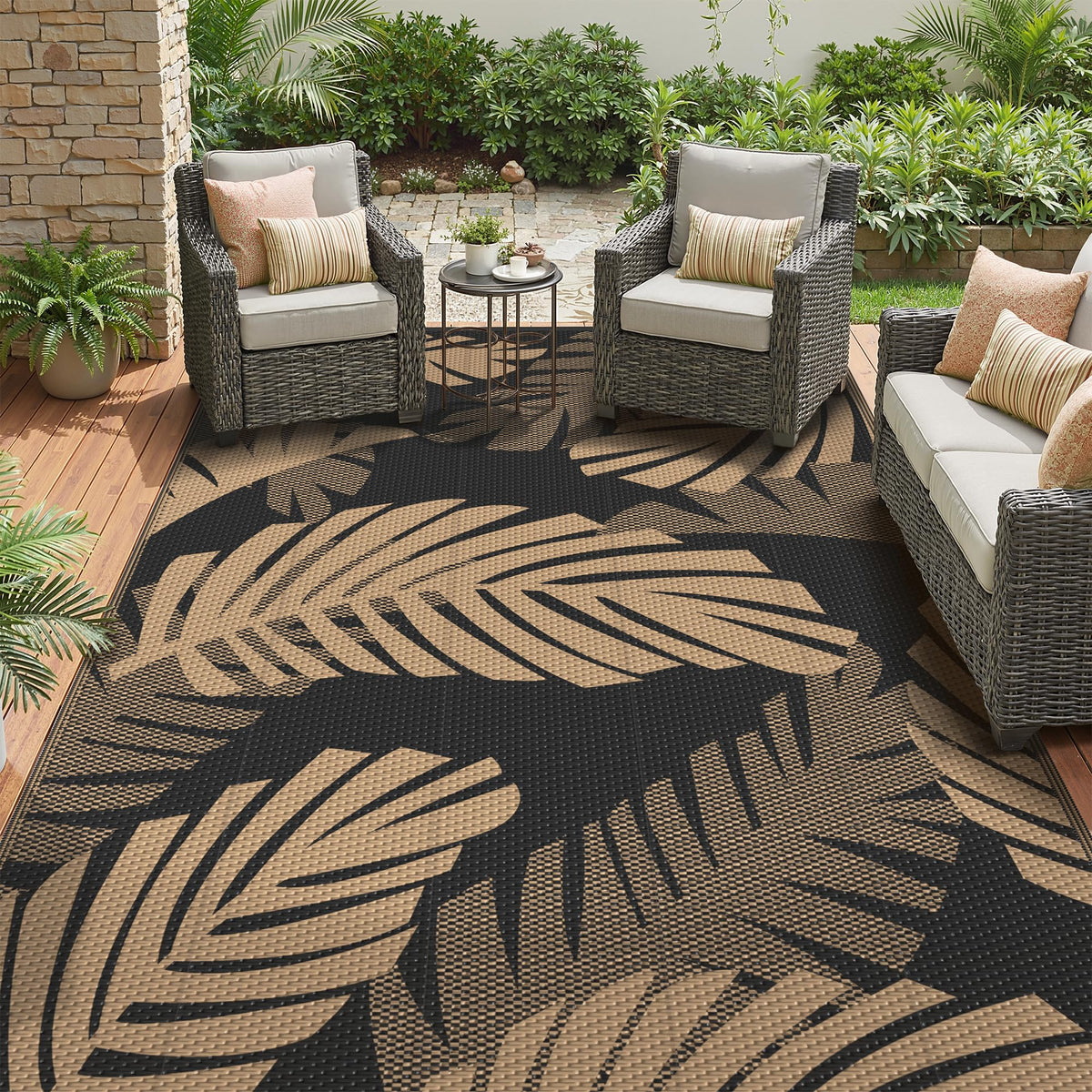 GENIMO waterproof outdoor rug with palm leaf pattern for patios and balconies.