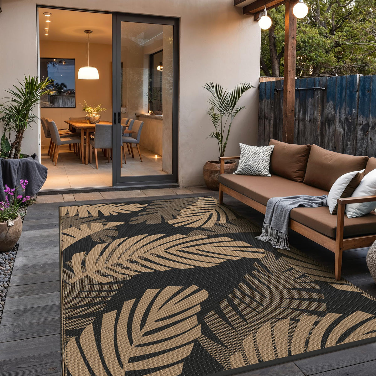 GENIMO palm-leaf rug rolled for easy transport during camping trips.