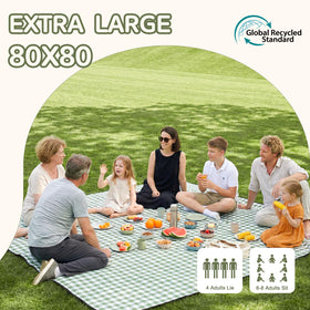 Genovega waterproof picnic blanket on the beach for sandproof seating.