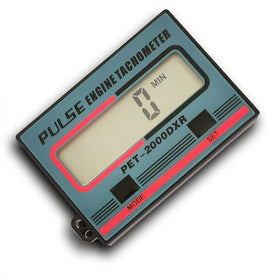 Gexmil tachometer with lawn mower engine for routine maintenance checks.