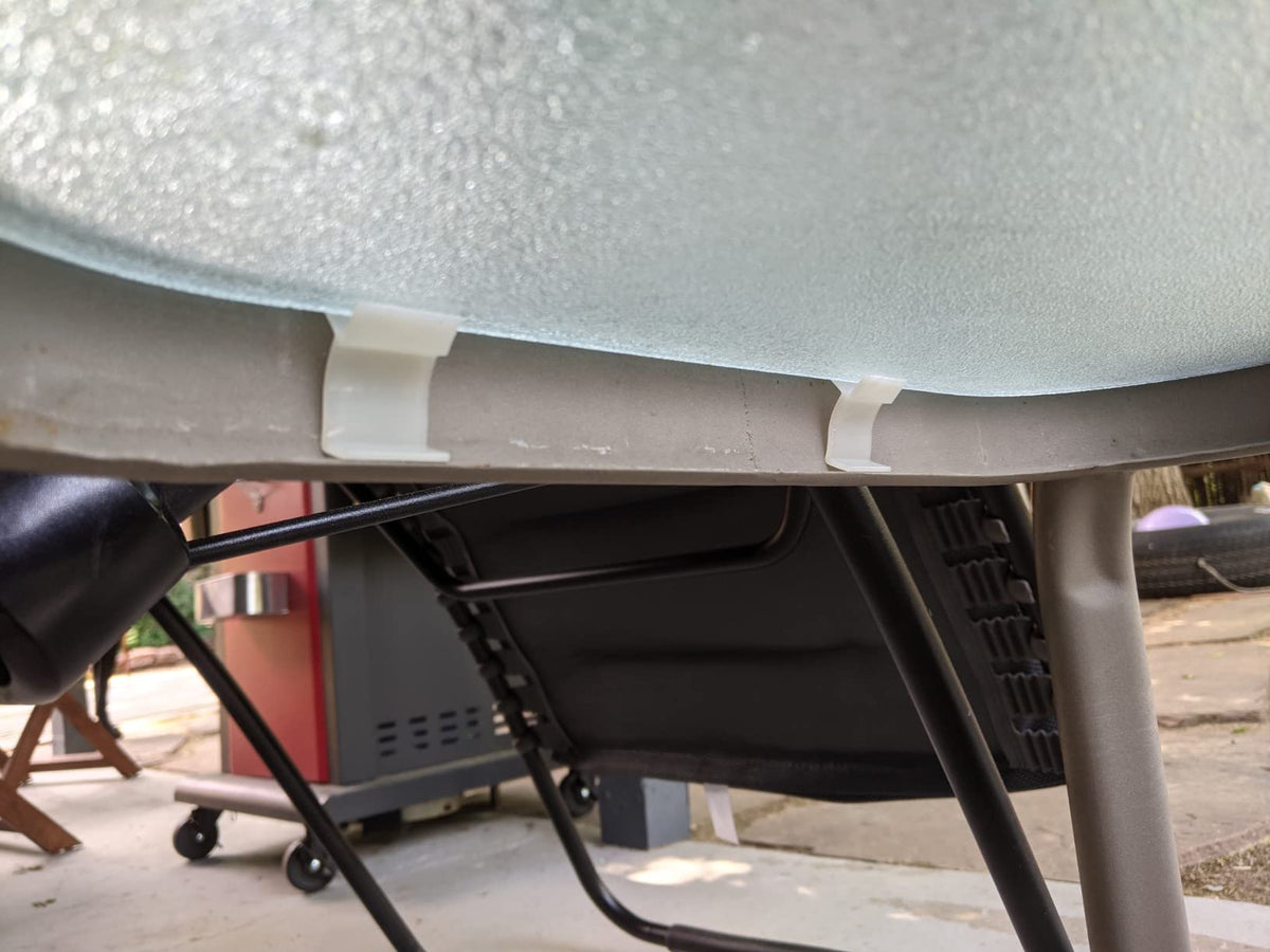 G GOODSZONE installation-ready rim clips in use on outdoor patio table