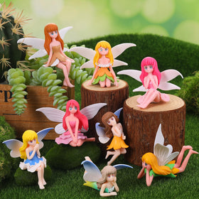 GGSTDDUP fairy figurines shown in terrarium display and moss landscape
