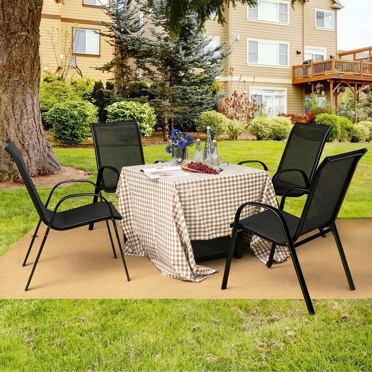 Giantex outdoor dining chairs by the poolside offer all-weather comfort.