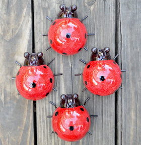 Giftme 5 four-pack red ladybugs outdoor wall sculptures brighten garden spaces.